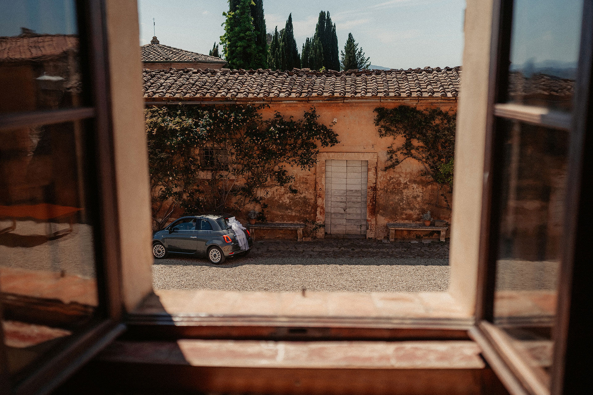 View into the courtyard at Villa Catignano through an open window